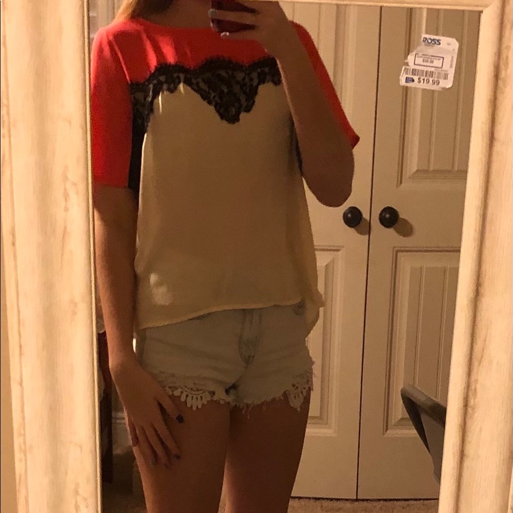 Red and cream blouse with black lace